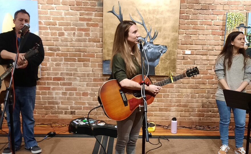 Guitarist John Hussman, Emily Burdette, and vocalist Jordan Hughes