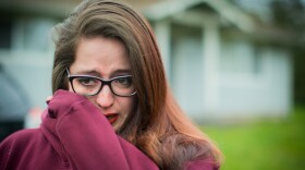 Outside the home of her foster sister Renee Davis, Danielle Bargala breaks down in tears while talking about how Davis' young children are living with different families. Davis, who was pregnant, was shot at her Muckleshoot reservation home last October.