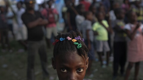 A girl waits with other earthquake victims for the start of a food distribution in Les Cayes, Haiti, in August, a week after a 7.2 magnitude earthquake hit the area.