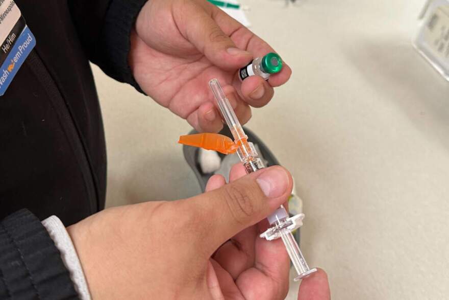 Licensed practical nurse Marco Flores prepares a patient's measles, mumps and rubella vaccine at Children's Minnesota on Nov. 20, 2025, in Minneapolis. Devi Shastri/AP)