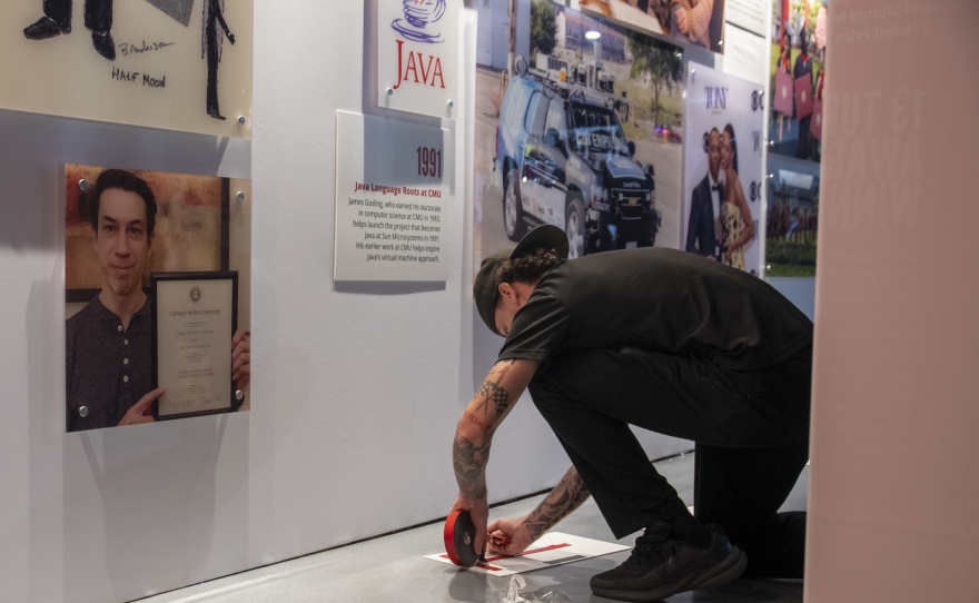 Staff set up a timeline detailing the history of Carnegie Mellon University in preparation of its satellite campus opening in Miami. Thursday, Oct. 1, 2026, in Miami, Fla.