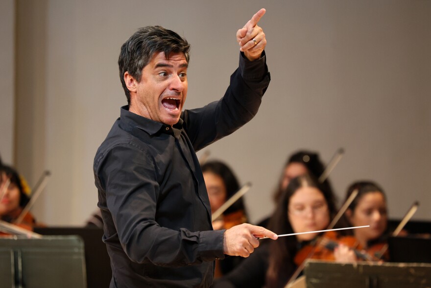 FIU Symphonic Orchestra Conductor Javier José Mendoza leads orchestra players during a rehearsal at the Herbert and Nicole Wertheim School of Music & Performing Arts Nov. 18, 2025.