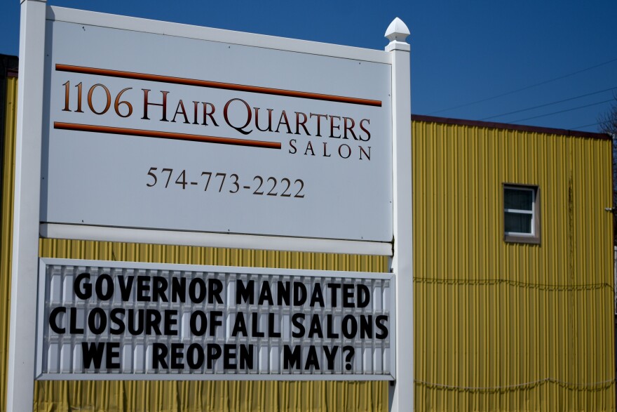 A hair salon in Nappanee displays a closure sign in April 2020 related to Gov. Eric Holcomb's COVID-19 executive orders.