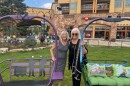 Artists Kelly Gallagher (left) and Peg Bodell (right) stand in front of their decorated chairs for the Sunset on Sunrise chair lift auction.
