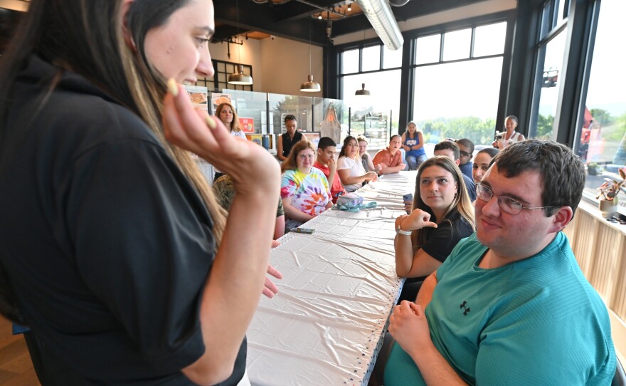 University of Scranton student Julia Gallo speaks to those attending the coffee inclusive Fourth of July themed cooking class.