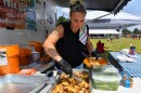 Jennifer Champi of Kate's Place prepares an order of mild garlic wings at the Swoyersville Chicken Wing Fling.
