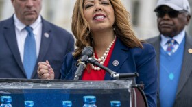 Rep. Lucy McBath, flanked by Rep. Dan Kildee and House Majority Whip James Clyburn, speaks to reporters about a bill to cap the price of insulin at the Capitol on March 31, 2022.