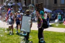 A "No Kings" rally at the Michigan Capitol in Lansing, Mich., on June 14, 2025, featured drag performers, stilt walkers, bubble walls, satirical carnival games and more.