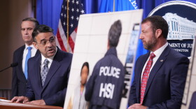 Daniel Rosen, U.S. Attorney for the District of Minnesota, speaks during a news conference at the Department of Justice, Wednesday Sept. 30, 2026, in Washington, as Attorney General Todd Blanche, left, and Secretary of Homeland Security Markwayne Mullin, look on.