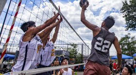 A player on the Boston Rising Tide attempts to spike the ball against the Hurricanes at Reggie Wong Memorial Park in Chinatown. (Jesse Costa/WBUR)