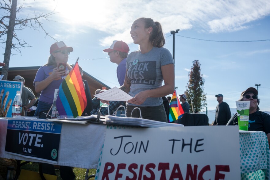 Sierra McMurry registers voters during a 'Love Trumps Hate' rally in Missoula, Oct. 18. 2018.