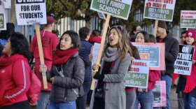 Striking Los Angeles Unified District teachers are joined by parents and students in front of Evelyn Thurman Gratts Elementary School in Los Angeles on Tuesday, Jan. 22, 2019. A tentative deal was reached Tuesday between Los Angeles school officials and the teachers union that will allow educators to return to classrooms after a six-day strike against the nation's second-largest district, officials said. (Richard Vogel/AP)