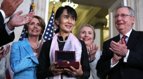 Burmese opposition politician Aung San Suu Kyi is presented with a U.S. Congressional Gold Medal at a ceremony at the rotunda of the U.S. Capitol on Wednesday in Washington, D.C.