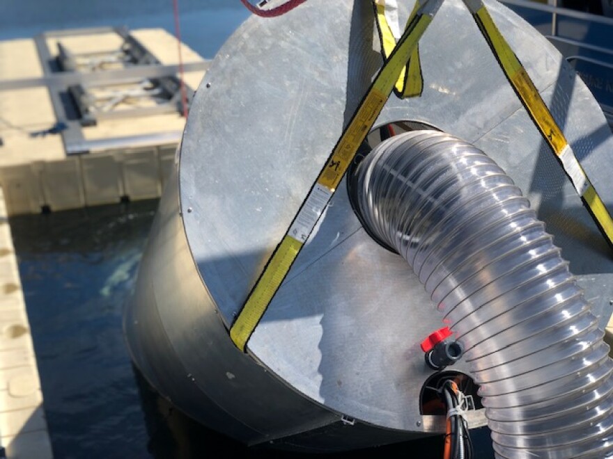 The OceanWell pod being lowered into Las Virgenes Reservoir for testing.