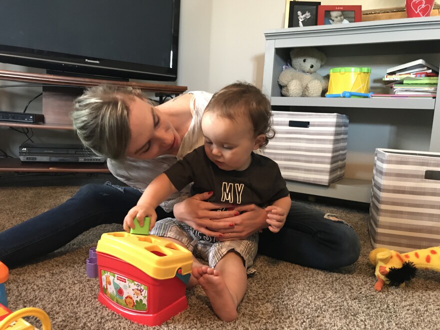 Courtney Reimlinger plays with her 16-month-old son, Kallum. The 23-year-old Indianapolis woman was hospitalized with postpartum eclampsia a week after Kallum was born.