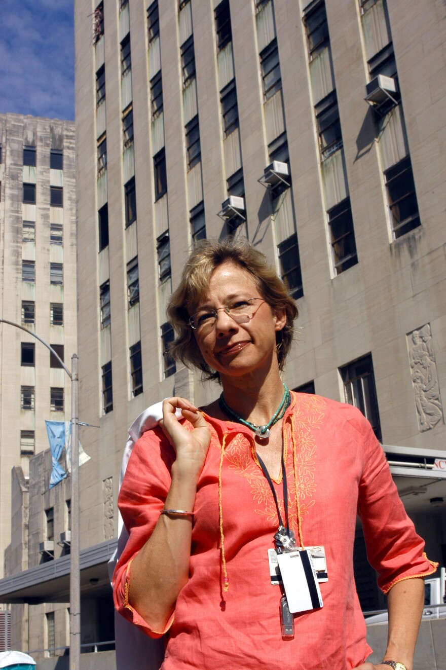 Dr. Ruth Berggren stands outside Charity Hospital in New Orleans in 2005, where she had earlier cared for patients during Hurricane Katrina.