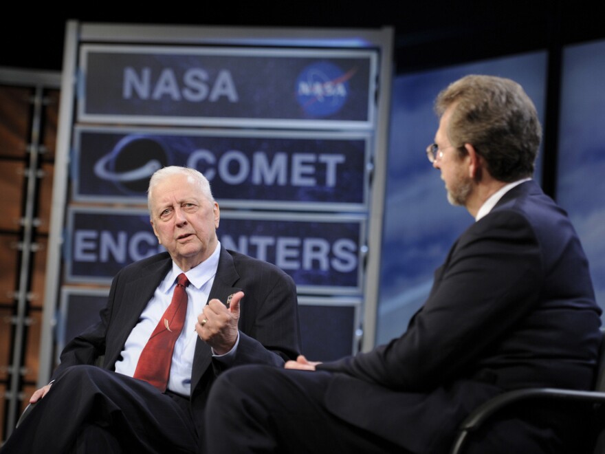 During a 2010 symposium commemorating a quarter-century of comet discoveries, Farquhar (left) swapped stories with James L. Green, NASA's director of planetary science.