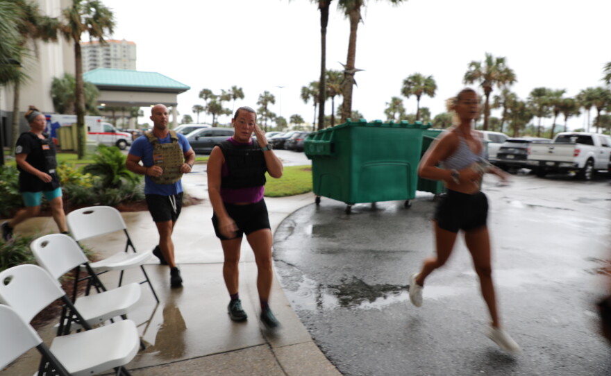 Locals participate in the 9-11 stair climb on Navarre Beach.