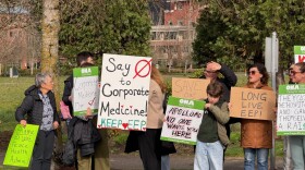 people holding signs