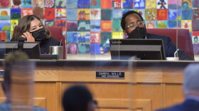School Board Chairwoman Elizabeth Andersen and Vice Chairman Darryl Willie listen to public comments during a meeting.