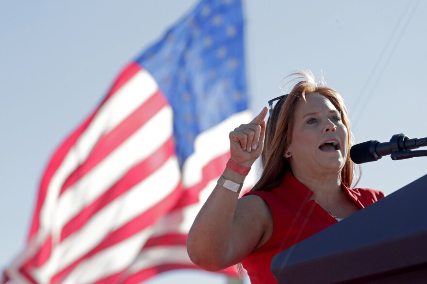 Sandy Smith, Republican candidate for U.S. House disctrict 1 from North Carolina, speaks to the crowd at former President Donald Trump's rally Friday, Sept. 23, 2022, in Wilmington, N.C.