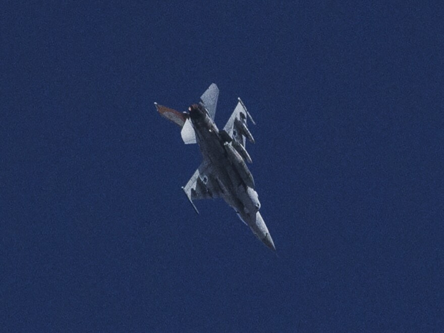 An Israeli jet fighter flies near the Gaza Strip, as seen from southern Israel, Friday, Nov. 10, 2023.