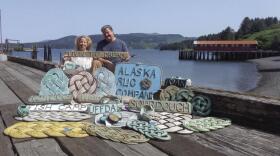 Anita and Robert Shane perch next to some of the products they create and sell through the Alaska Rug Company.