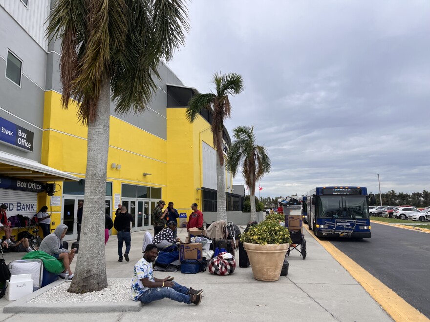 People who sheltered in Hertz Arena in Estero during and after Hurricane Ian wait for transportation to Lee County’s new shelter in the Del Tura Plaza in North Fort Myers. On October 19 Lee Tran buses took the people to the new location as they wait for longer-term housing options.