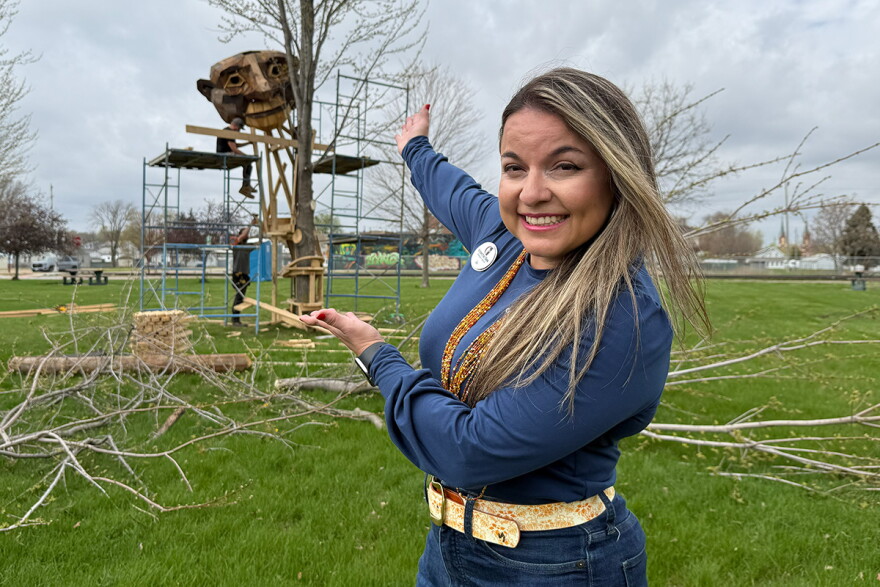 Ari Lewerenz stands in front of the troll, Helmut, as it is being constructed. 