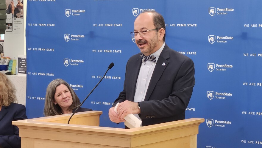 Retired Chancellor Marwan Wafa expresses gratitude during remarks in the renovated library.