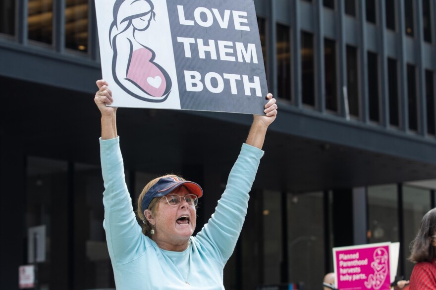 Rita Sweeney, a member of Pro Life Action League, screams at opponents of Texas’s new abortion ban during the Bans Off My Body rally on Sept. 10, 2021