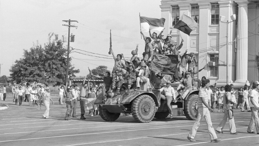 Sandinista rebels ride an armored vehicle through Managua, the Nicaraguan capital, on July 19, 1979, after ousting dictator Anastasio Somoza. Latin America has endured civil wars for the past six decades, but only two groups, the Sandinistas and Fidel Castro's rebels, ousted leaders by force.