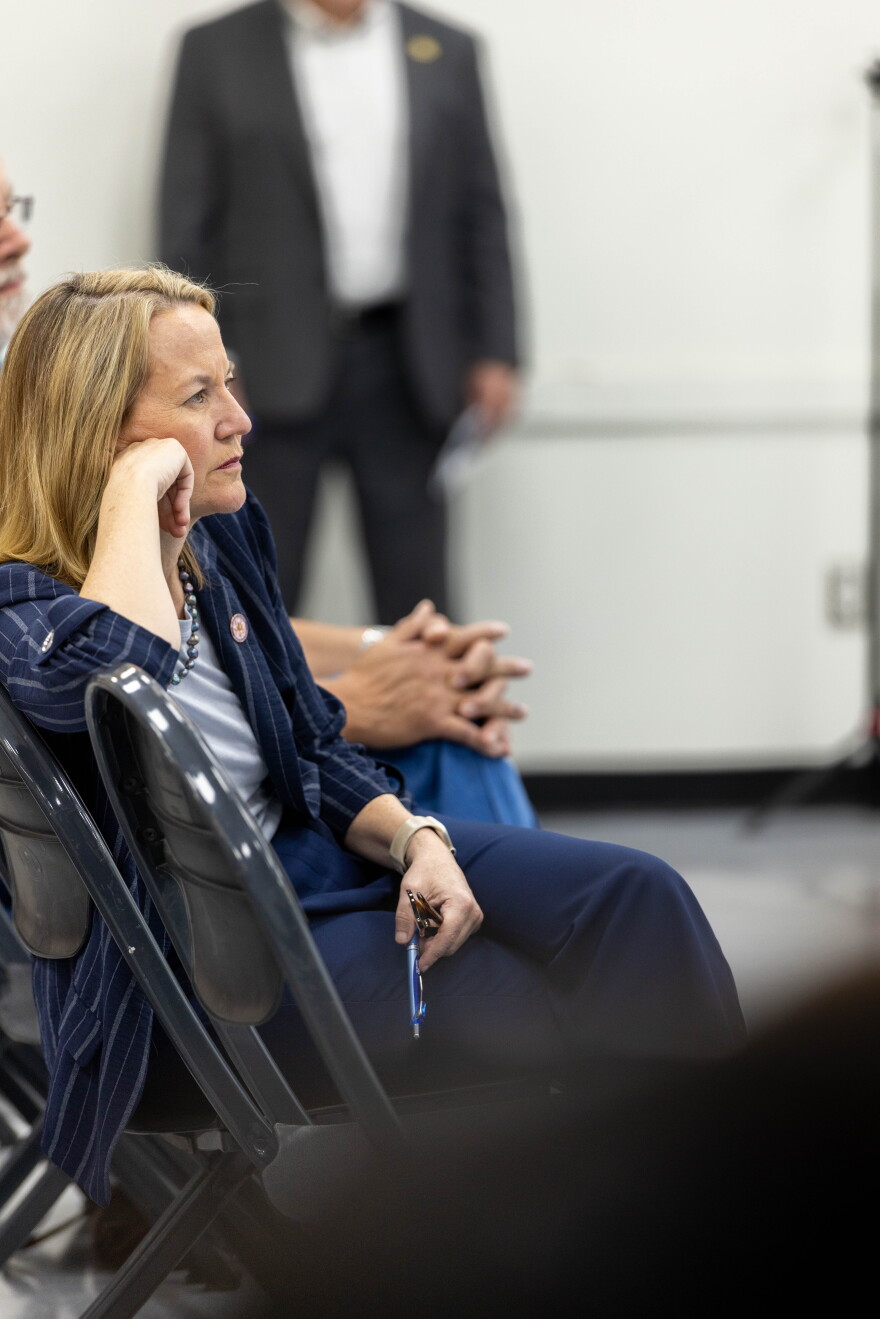 Attorney General Kris Mayes pays attention to Elene Macadam's powerpoint presentation during Yuma's biosolids townhall in July.