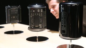 An attendee looks at the new Mac Pro during an Apple announcement event in San Francisco.