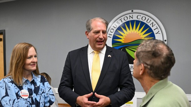 Rhett Marques speaks to two attendees at a Houston County Republican meet the candidates event in Dothan, Alabama.