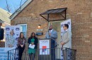 Greater Cincinnati Realtist Association President Darrick Dansby speaks in front of a home The Port purchased from an out-of-town landlord in 2022.