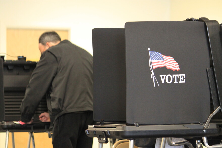 A voter casts a ballot at an early voting site in Albuquerque, N.M., on Thursday, Nov. 3, 2016. (Susan Montoya Bryan/AP Photo)