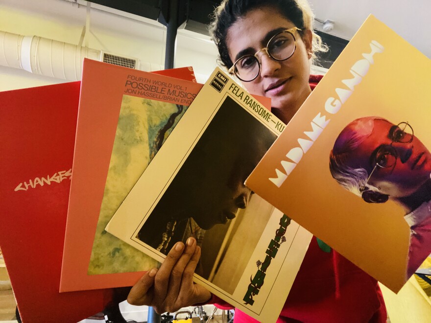 Madame Gandhi poses with her record collection.