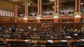 Speaker of the House Matt Ritter, D-Hartford, speaks in a mostly empty legislative chamber due to pandemic protocols, during opening session at the State Capitol, Jan. 6, 2021, in Hartford.