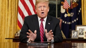 President Trump speaks from the Oval Office as he gives a prime-time address about border security Tuesday. (Carlos Barria/Pool Photo via AP)