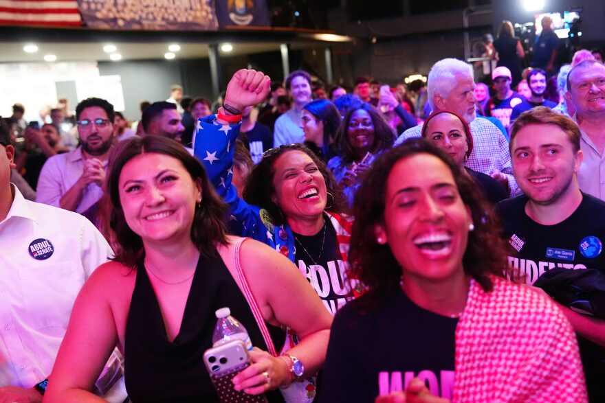 Attendees listen as Abdul El-Sayed speaks during a primary election night event. 