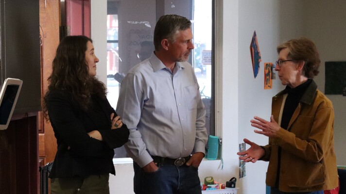 SFCC President Becky Rowley (right) speaks to U.S. Senator Martin Heinrich (D-NM) (center) and Early Childhood Center of Excellence Executive Director Catron Allred (left) during a tour of SFCC's Kids Campus