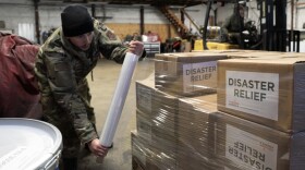 Alaska Organized Militia personnel, assigned to Task Force Bethel, prepare relief supplies for distribution to nearby villages during post-storm recovery efforts for Operation Halong Response at Bethel, Alaska on Nov 19, 2025.