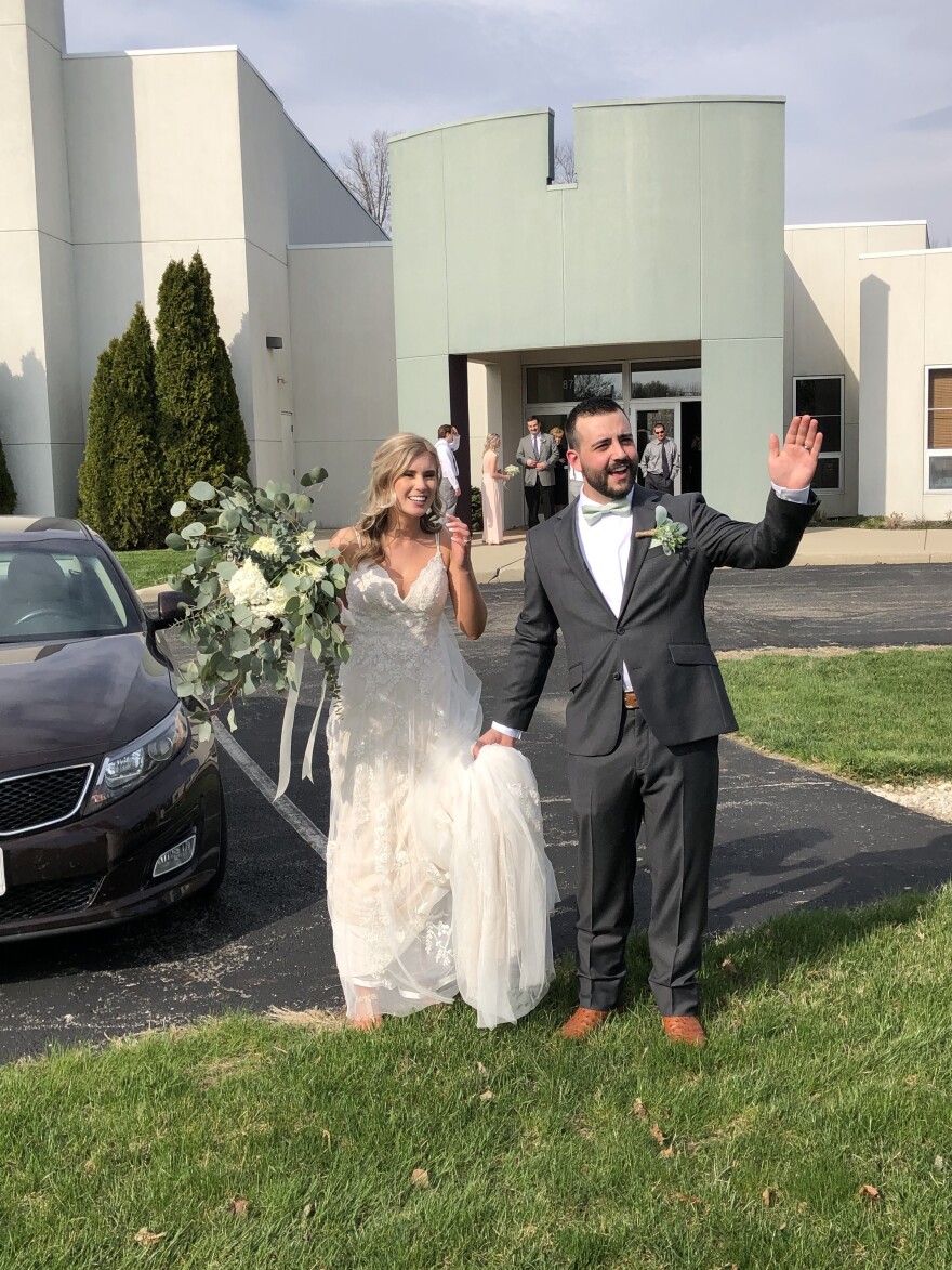 Madison McHugh McGraw and Grant McGraw greet guests in parking lot [Supplied by Madison McHugh McGraw]