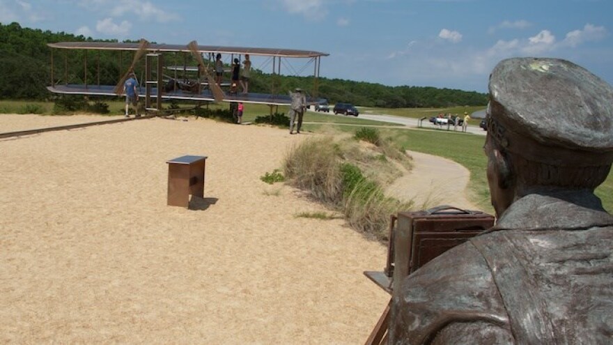 Sculpture of the Wright Brothers first flight at the Wright Brothers National Memorial in Kill Devil Hills