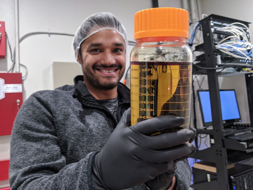 Premium Extracts CEO Jose Rivas holds a jar of pure THC, the main psychoactive compound found in cannabis. It’s one of the many cannabis extracts his Woodlake-based company produces.