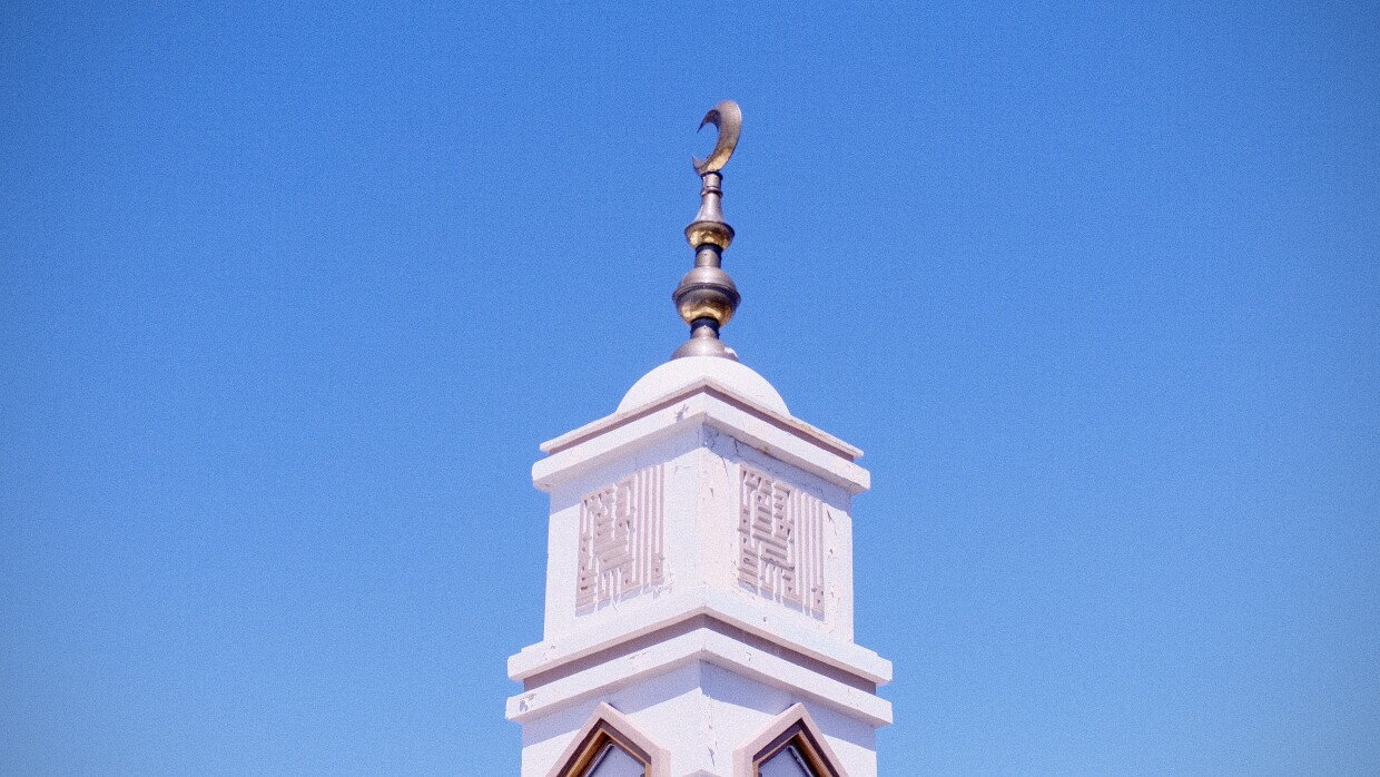 Crescent-topped minaret at the Northern Nevada Muslim Community Center in Reno, Nevada, under a clear blue sky.