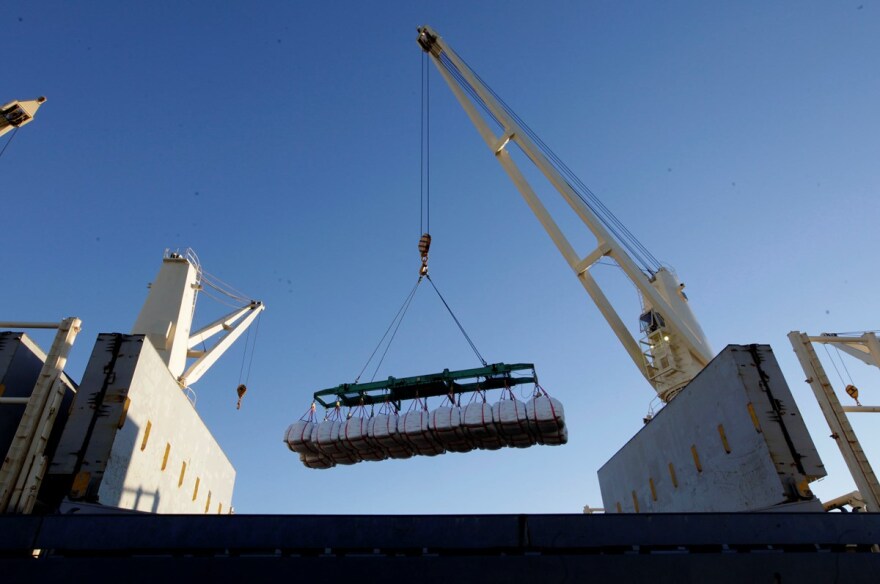 In this photo taken Friday, Nov. 23, 2012, rice bound for Japan is loaded aboard a ship at the Port of Sacramento in West Sacramento, Calif