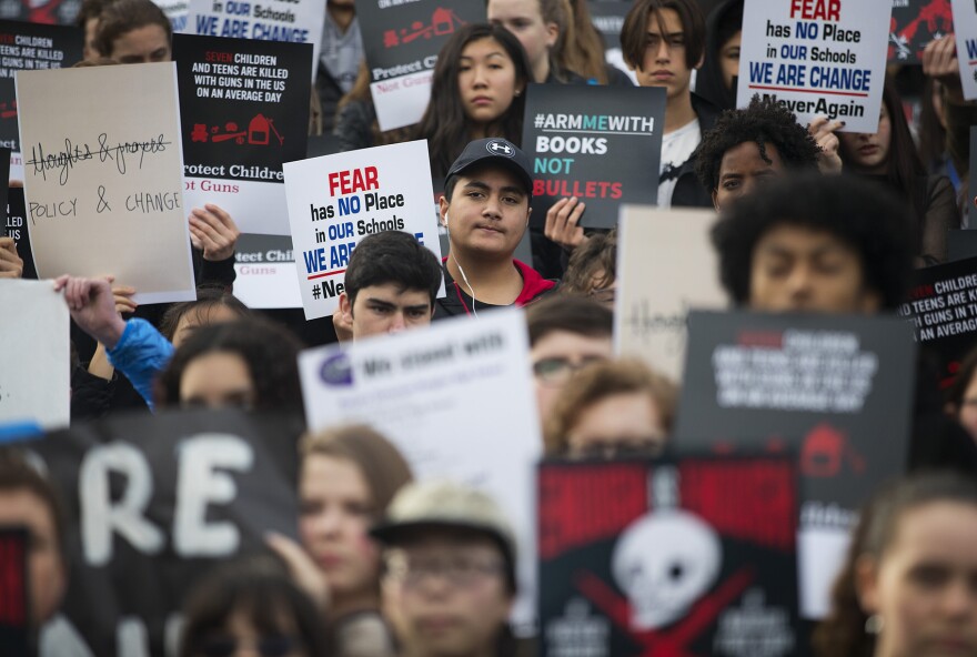 Students from Garfield High School stand together during a moment of silence for the victims of the school shooting in Parkland, Florida, after walking out of school on Wednesday, March 14, 2018, in Seattle.