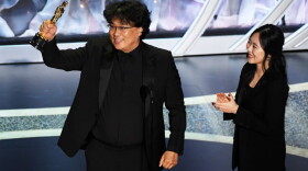 Bong Joon-ho accepts the International Feature Film award for "Parasite" with interpreter Sharon Choi onstage during the 92nd Annual Academy Awards. (Kevin Winter/Getty Images)
